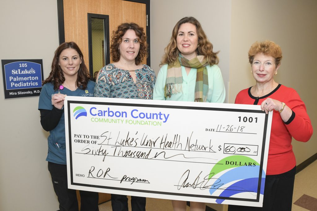 A photo of the Reach Out and Read grant check presentation at Palmerton Pediatrics.